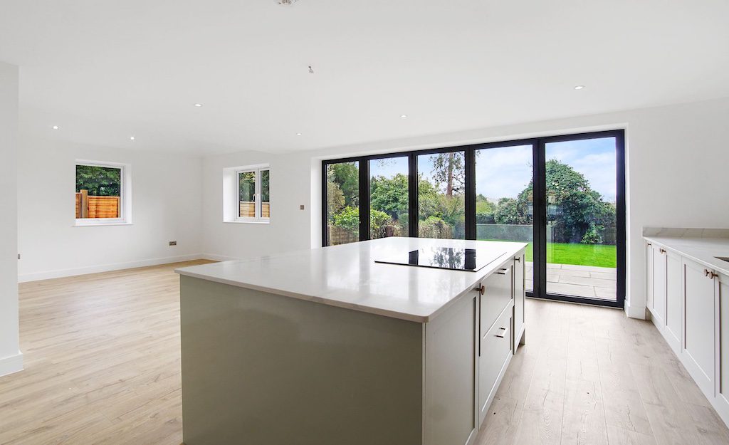 Modern kitchen extension with bifold doors – Surrey home