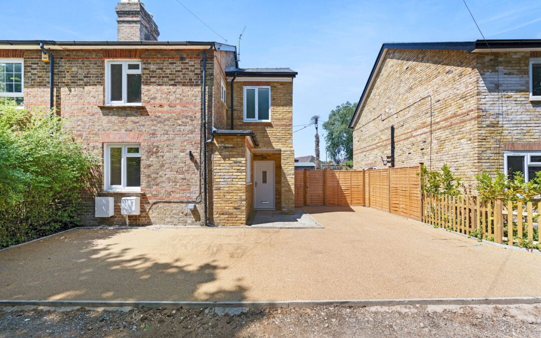 Modern double storey extension with large windows and garden view