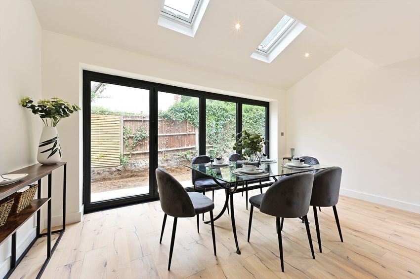 Side return kitchen extension featuring roof lantern and skylight combo