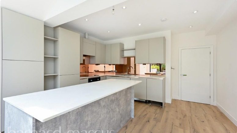 Modern utility room created from side return without internal wall removal